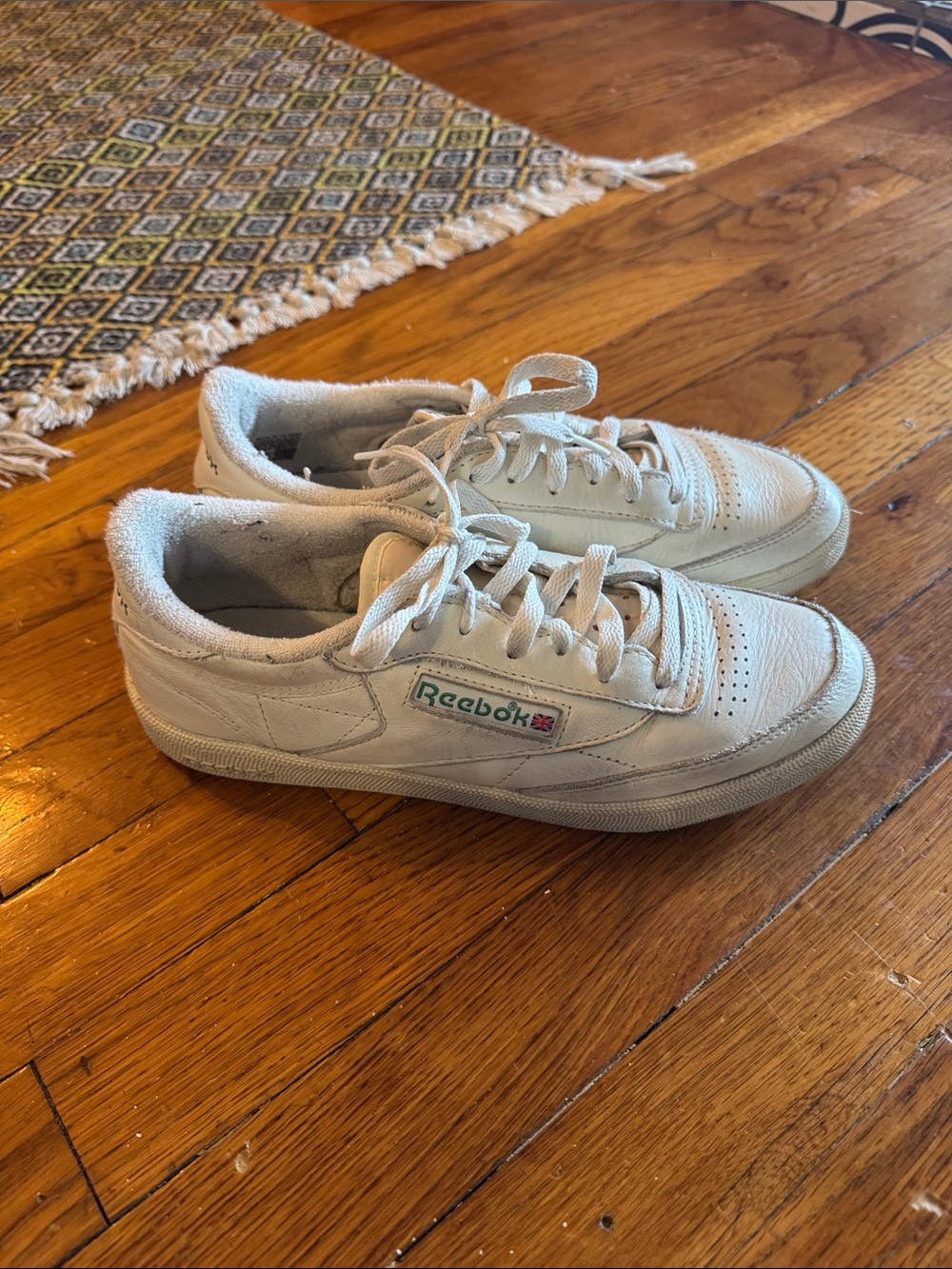 Reebok Women’s White Sneakers with Green Logo Accent